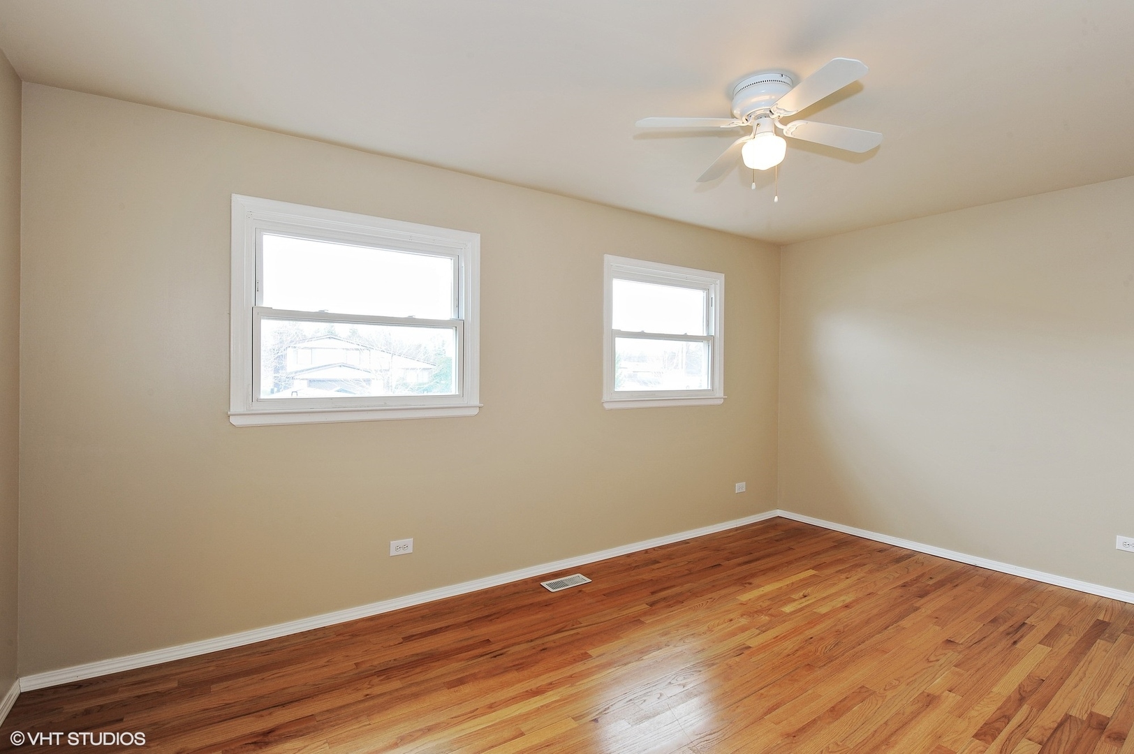 147 Spring Avenue Glen Ellyn, IL 60137 - Photo 9 of 14 a view of a room with wooden floor and fan