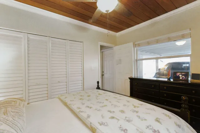 a bedroom with a bed and a dresser