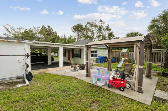 a view of a backyard with a patio