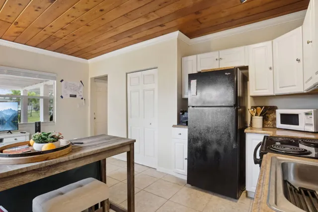 a kitchen with stainless steel appliances a refrigerator and a stove