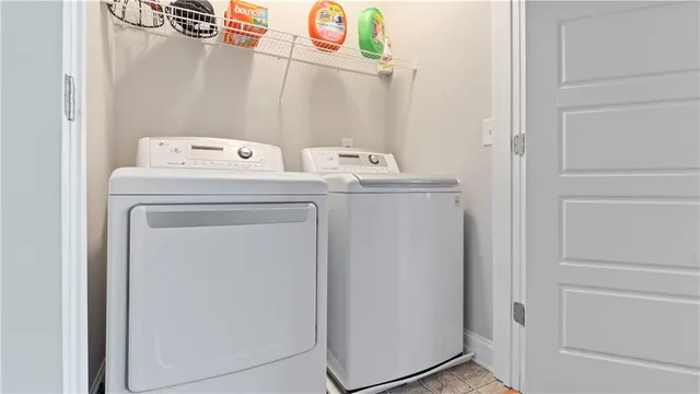 a utility room with dryer and washer