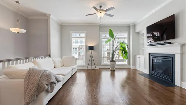 a living room with furniture fireplace and flat screen tv