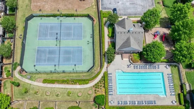 a view of a swimming pool with a potted plants