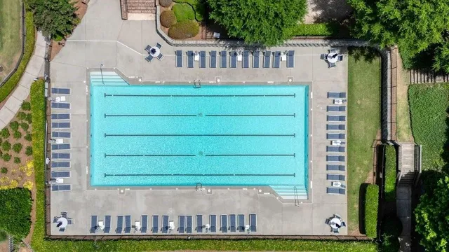 a view of a house with a tub and a yard