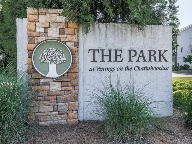 a view of outdoor space with signage and flags