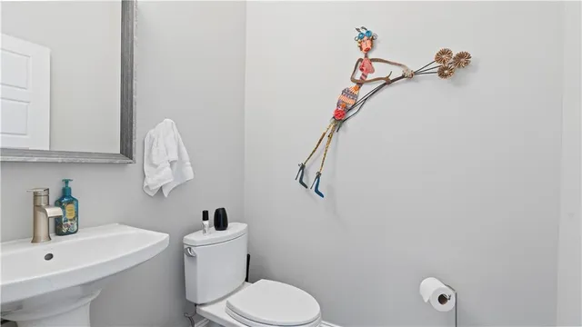 a bathroom with a toilet and a sink