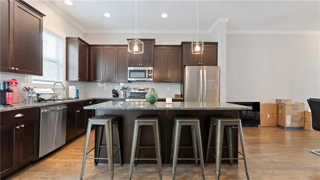 a kitchen with granite countertop a sink and counter space