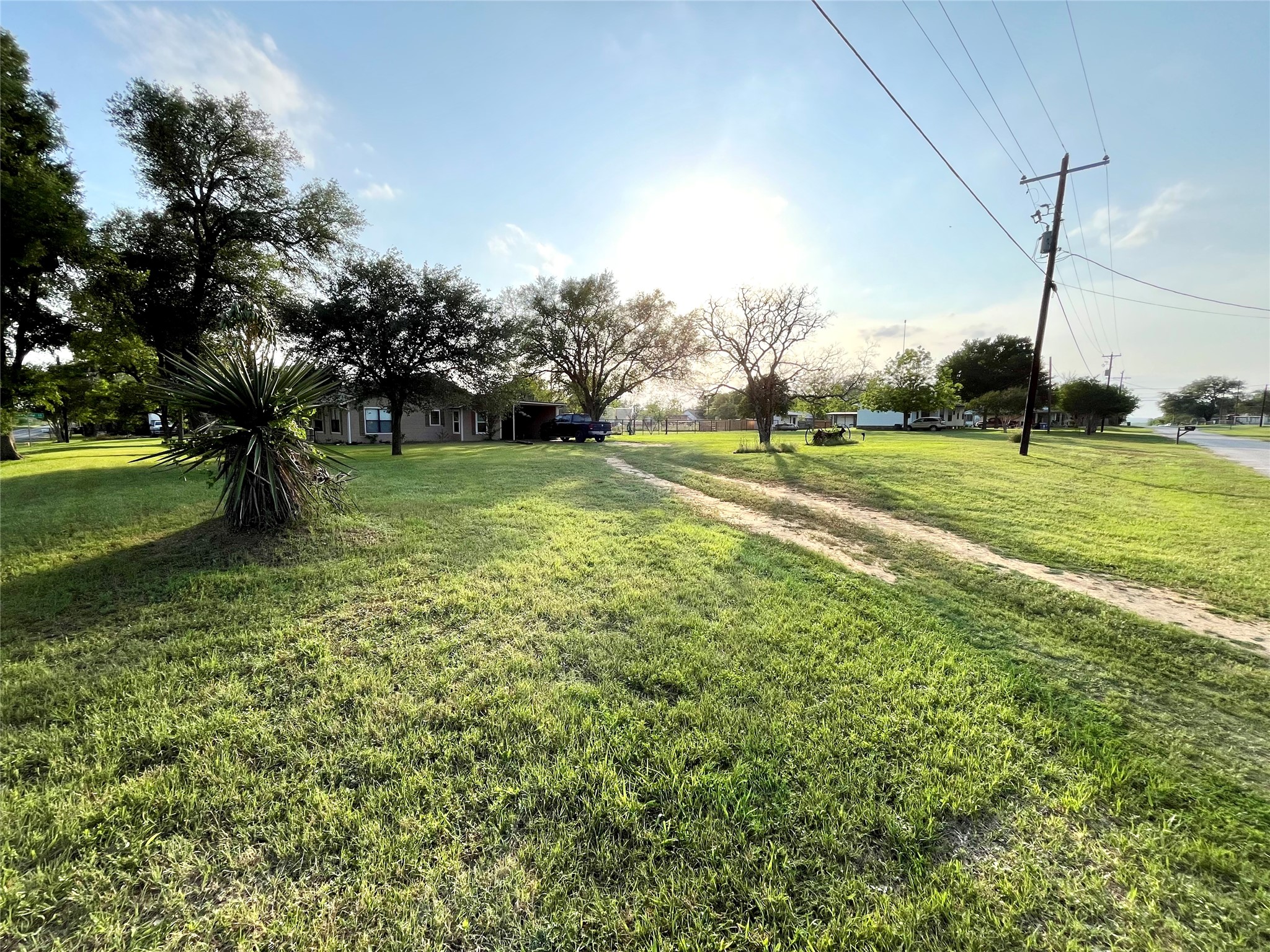 307 5th Street Sutherland Springs, TX 78161 - Photo 6 of 17 a view of a field with a tree