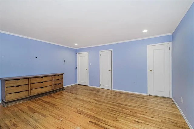 a view of room with wooden floor and window