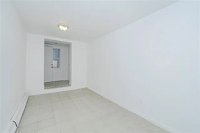 a view of an empty room and window