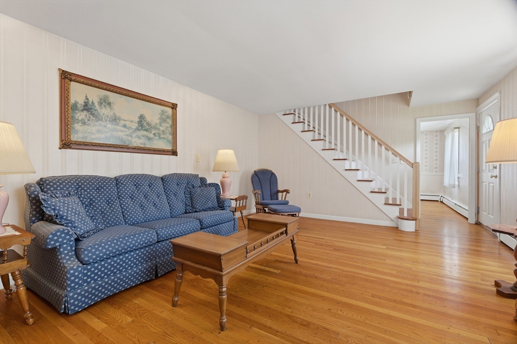 188 Glendale Road Attleboro, MA 02703 - Photo 2 of 37 a living room with furniture and a wooden floor