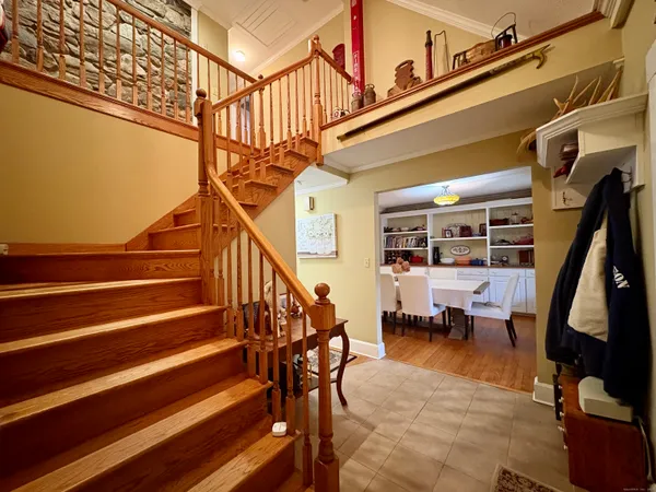 a view of entryway dining room and hall with wooden floor