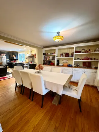 a living room with furniture a rug and a floor to ceiling window