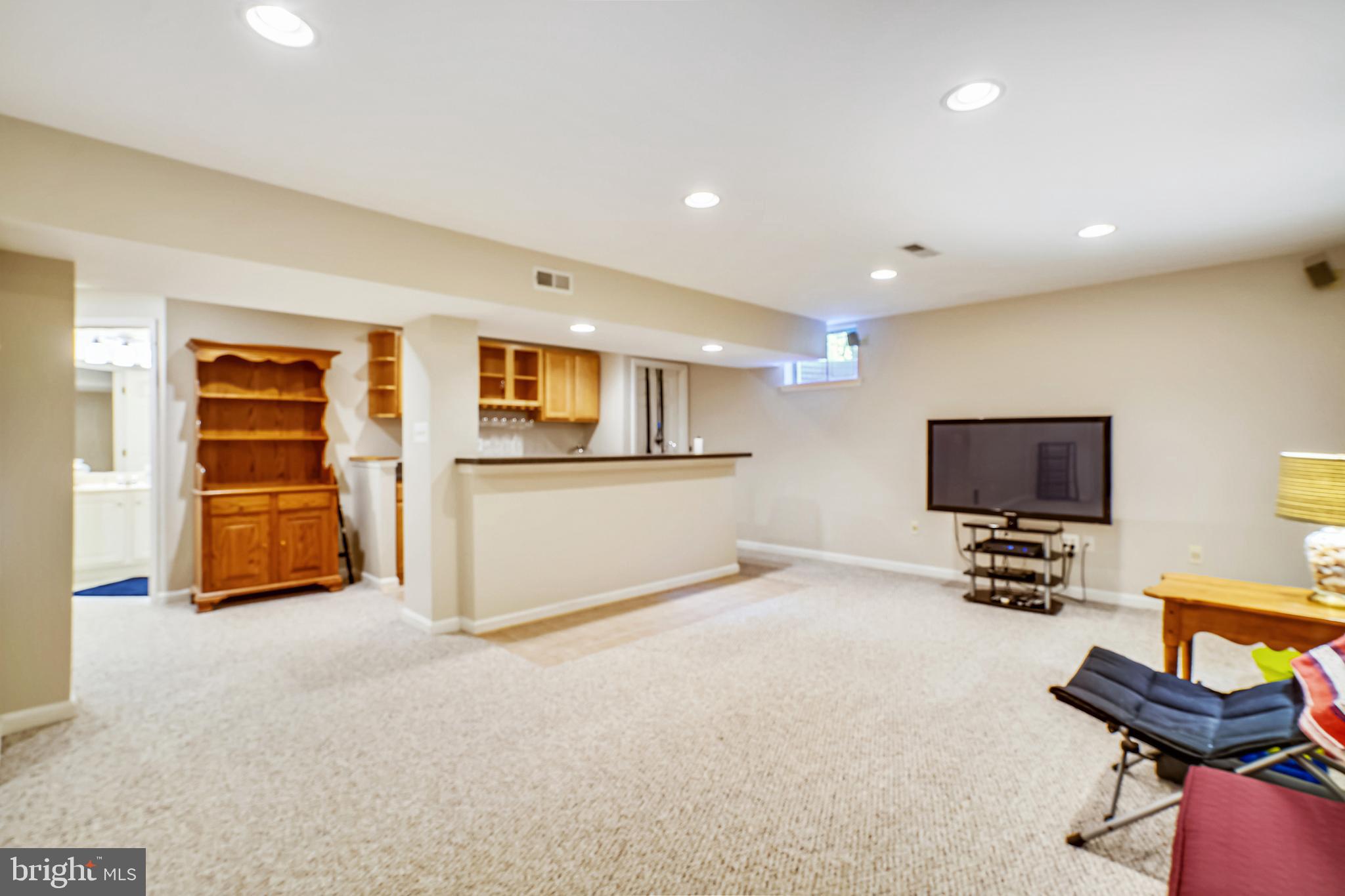 2320 Ridge Tree Court Ellicott City, MD 21042 - Photo 30 of 37 Lower Level Rec. Room with loop carpet & wet bar.