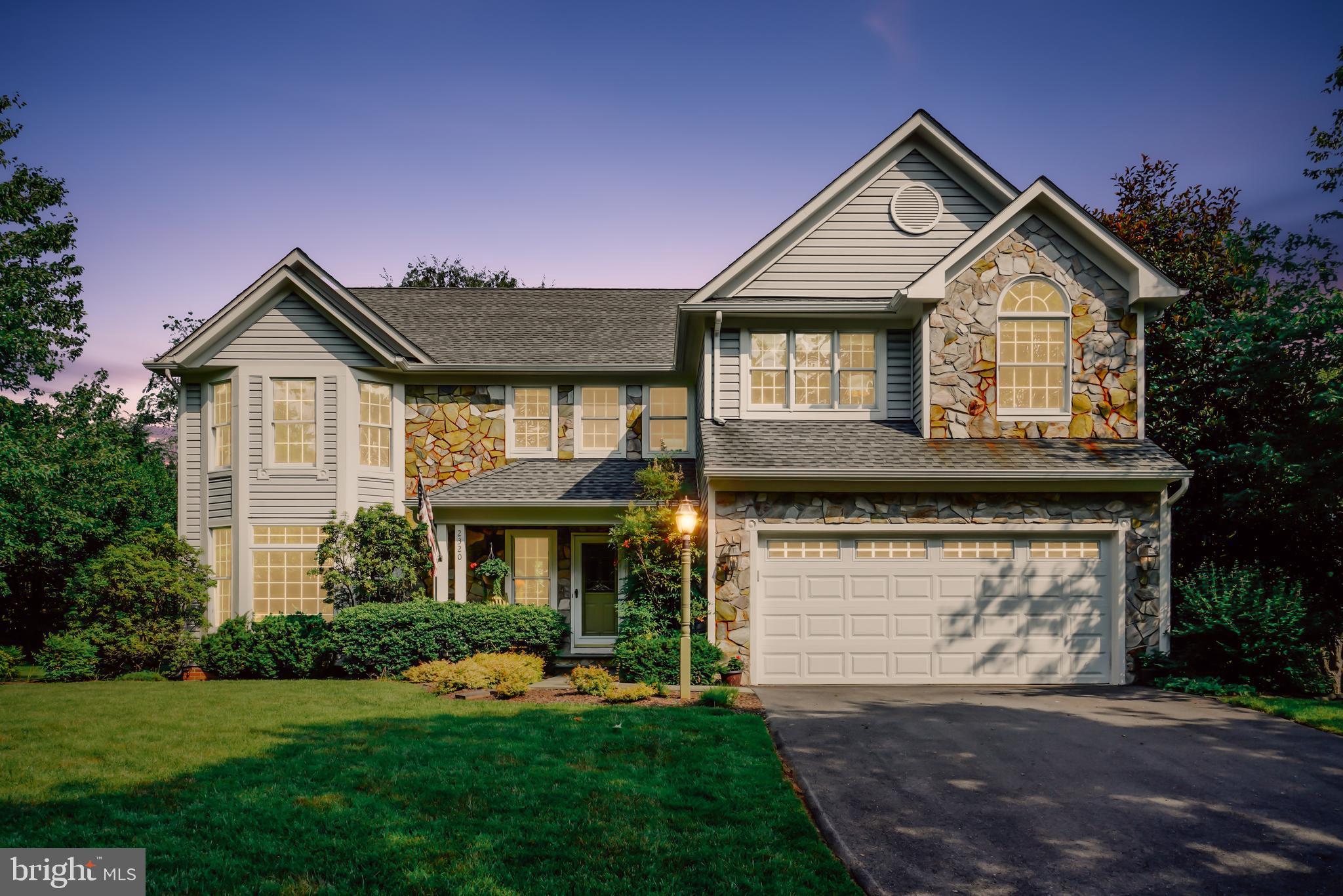 2320 Ridge Tree Court Ellicott City, MD 21042 - Photo 5 of 37 Front Exterior @ twilight featuring real stone.
