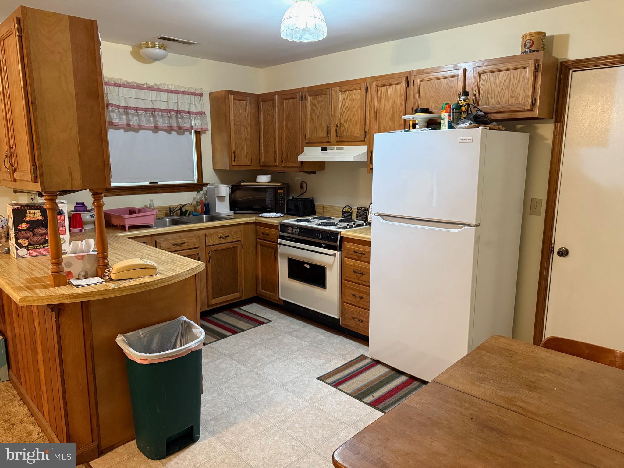 7206 Old Dickersons Road Orange, VA 22960 - Photo 11 of 32 a kitchen with a sink a stove and refrigerator
