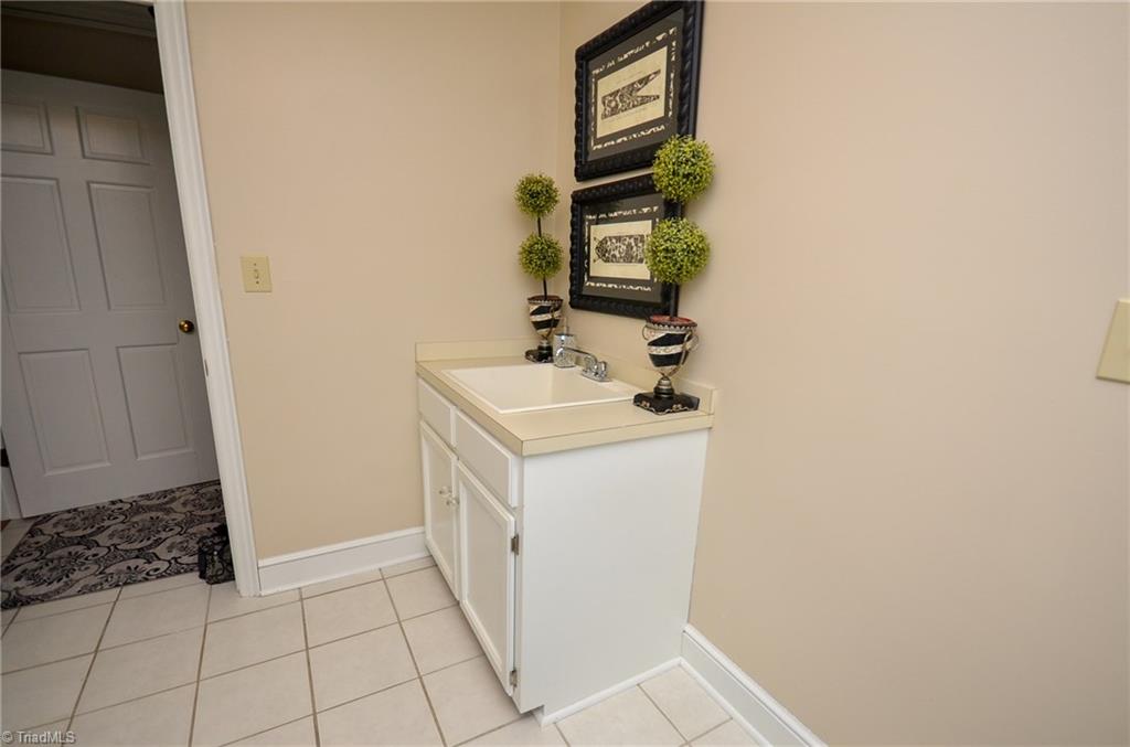 1434 Talbot Road Pleasant Garden, NC 27313 - Photo 14 of 30 Large Laundry Room, sink on opposite side of the Washer and Dryer