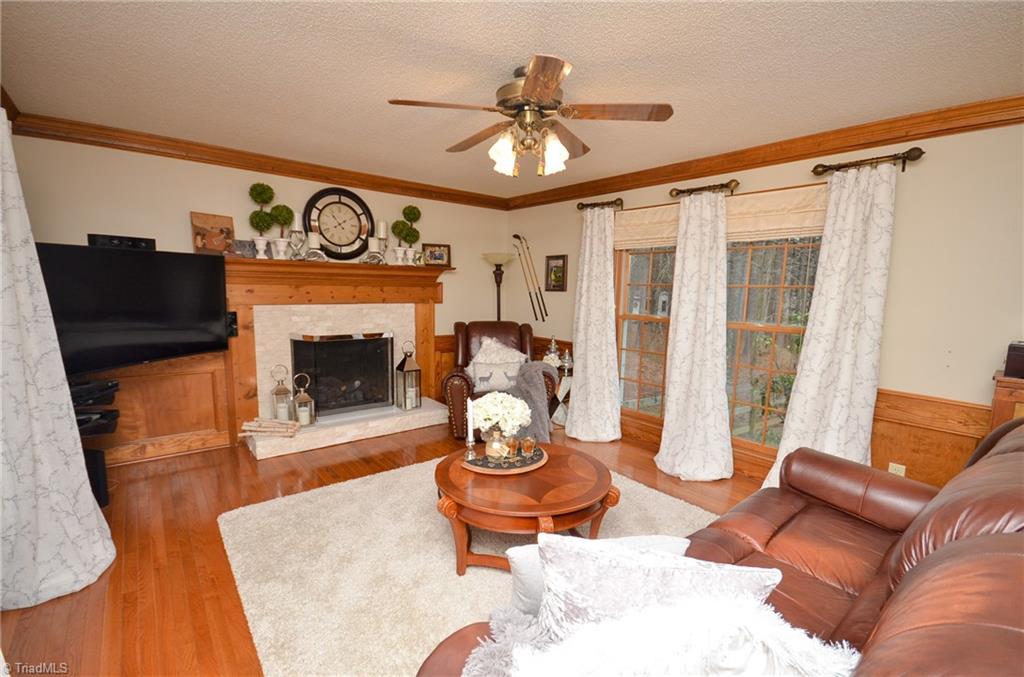1434 Talbot Road Pleasant Garden, NC 27313 - Photo 5 of 30 Cozy Den, Fireplace w/gas logs that look into the back yard, Hardwood floors