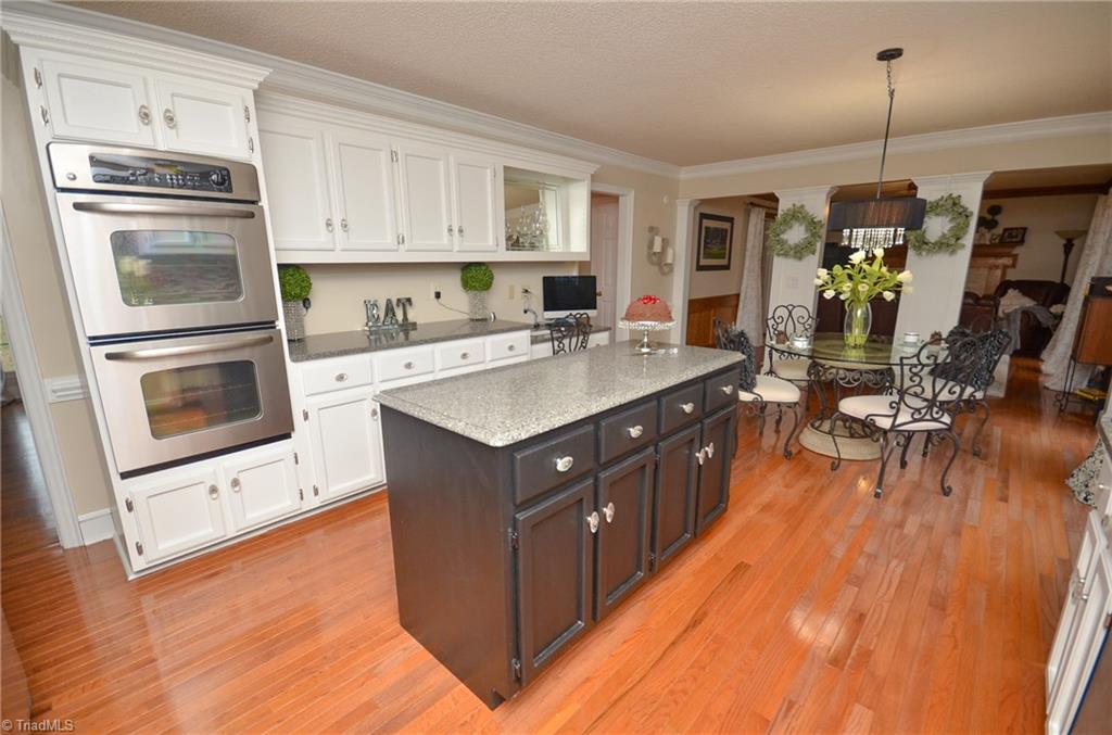 1434 Talbot Road Pleasant Garden, NC 27313 - Photo 10 of 30 Gourmet Kitchen, great for entertaining, hardwoods, double ovens, built in desk that looks into the Cozy Den