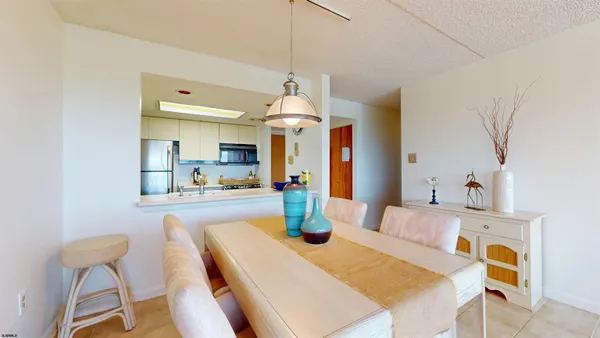 a dining room with a table and chairs