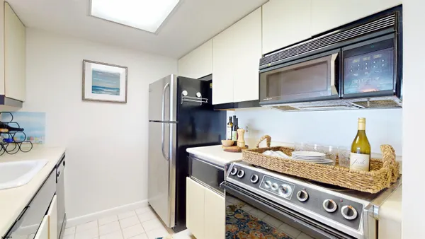 a kitchen with stainless steel appliances granite countertop a stove and a refrigerator