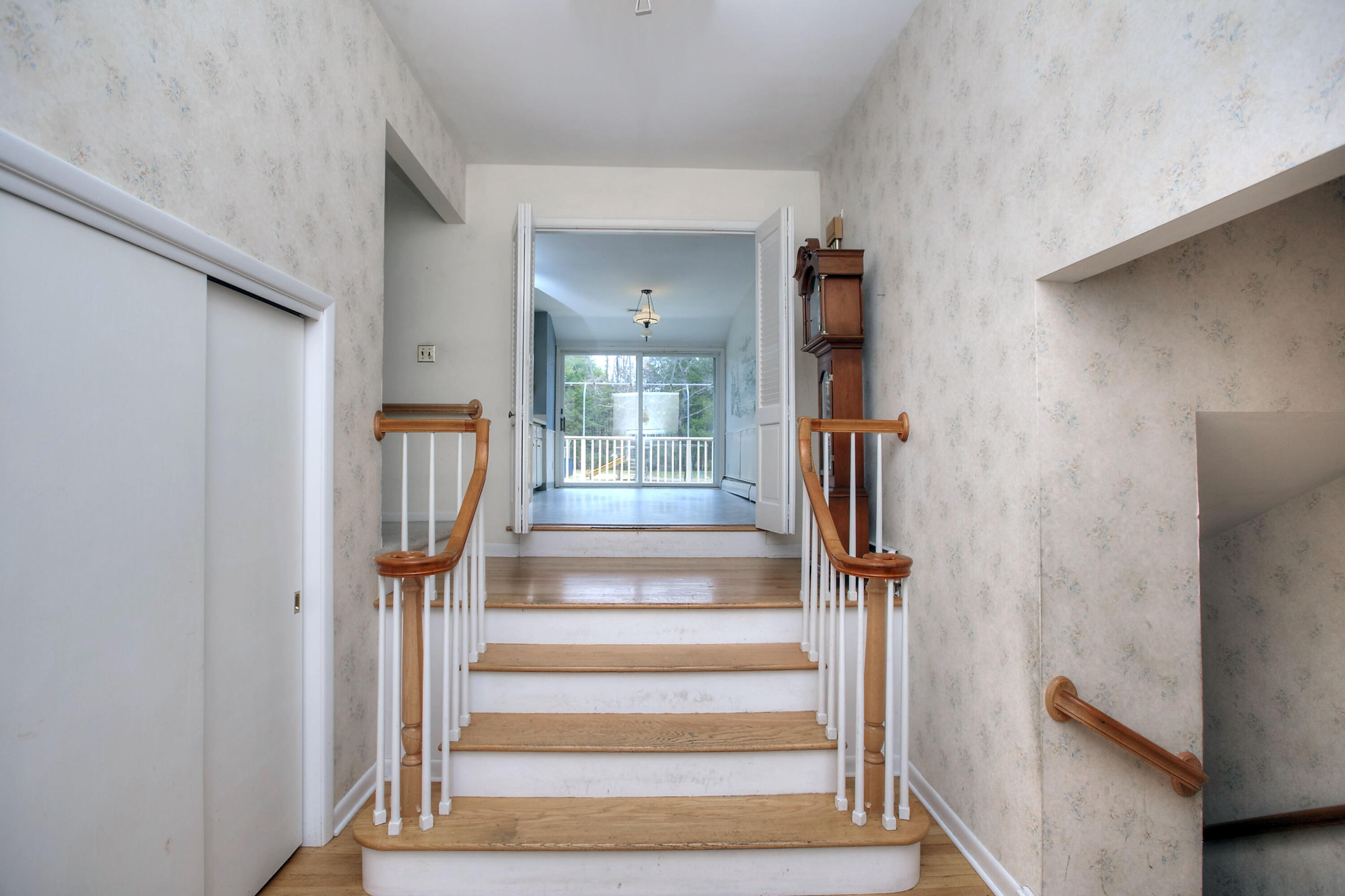 853 Valley Road New Canaan, CT 06840 - Photo 3 of 30 a view of staircase with white walls and railing