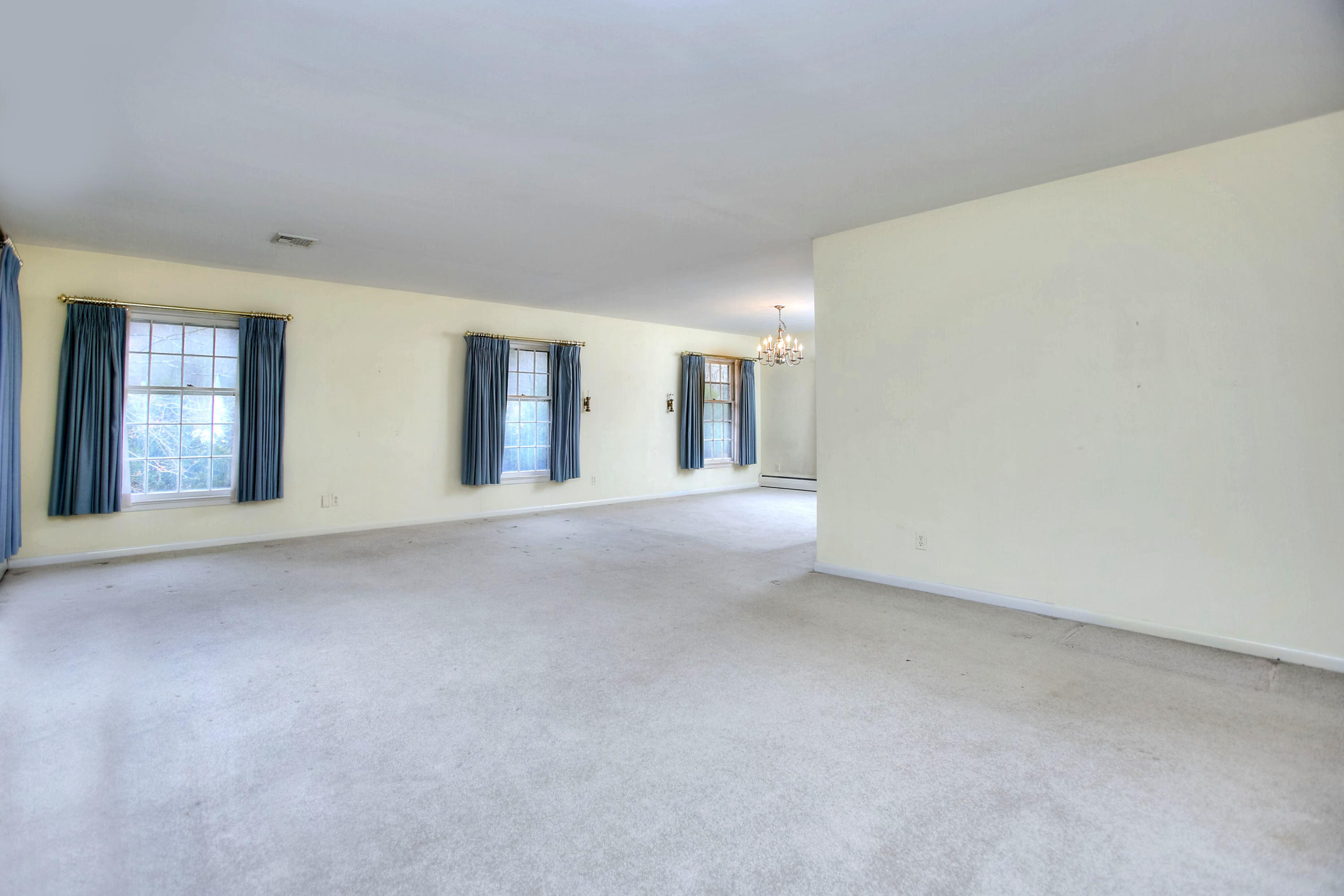 853 Valley Road New Canaan, CT 06840 - Photo 5 of 30 a view of an empty room with a window