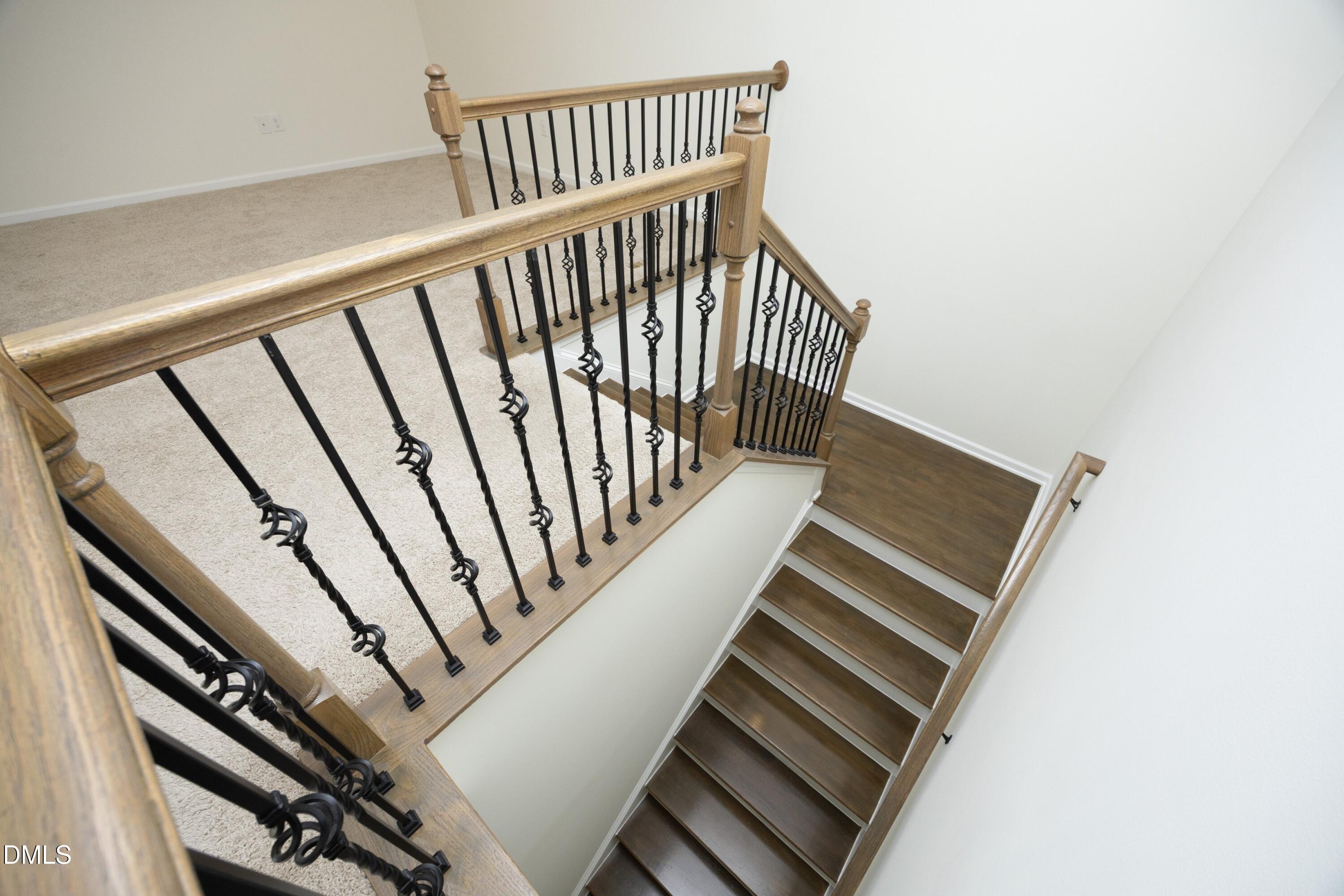 824 Country Downs Road Wake Forest, NC 27587 - Photo 20 of 41 a view of staircase with wooden floor