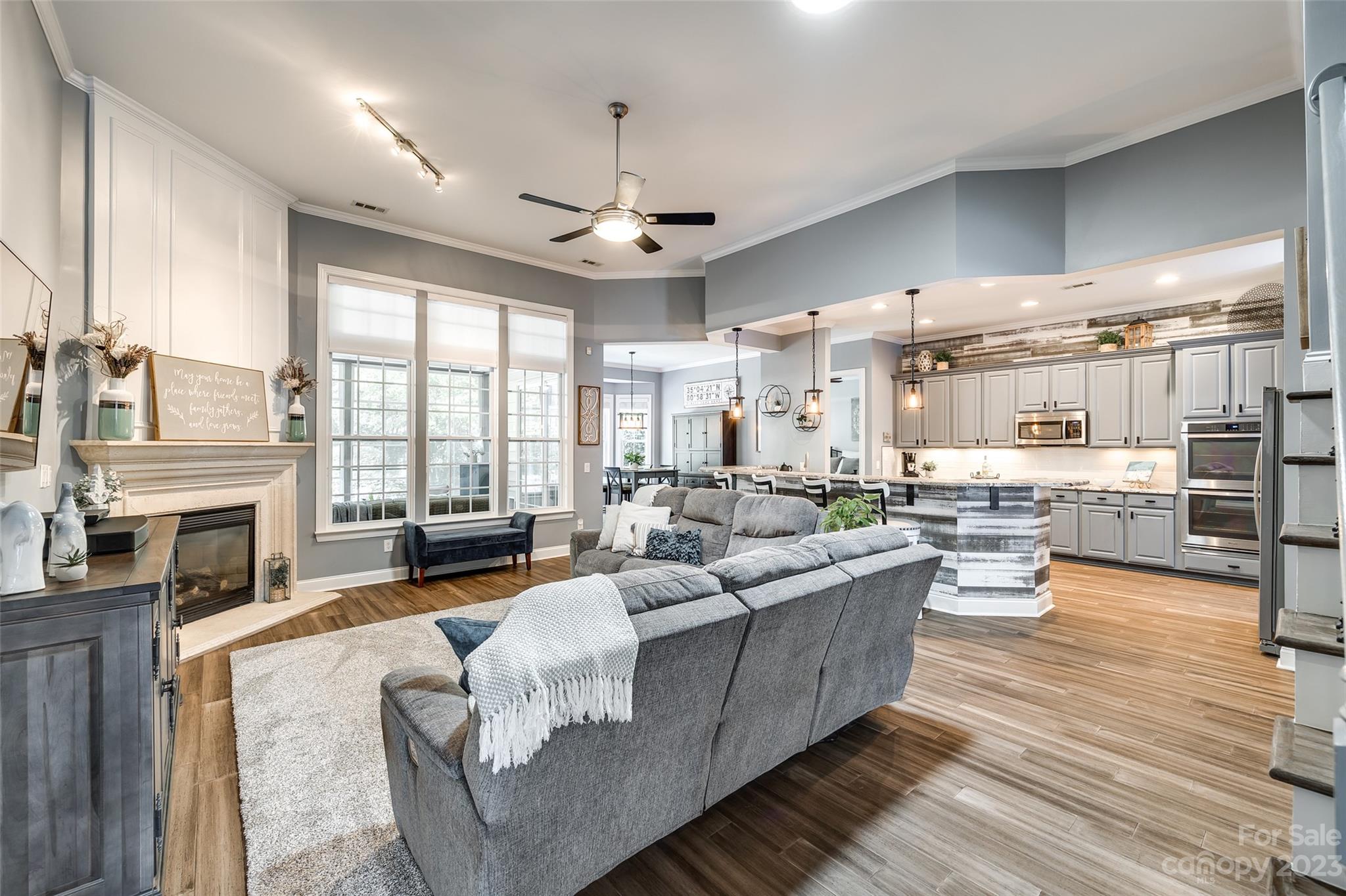675 Quicksilver Trail Fort Mill, SC 29708 - Photo 11 of 48 a living room with furniture fireplace and a large window
