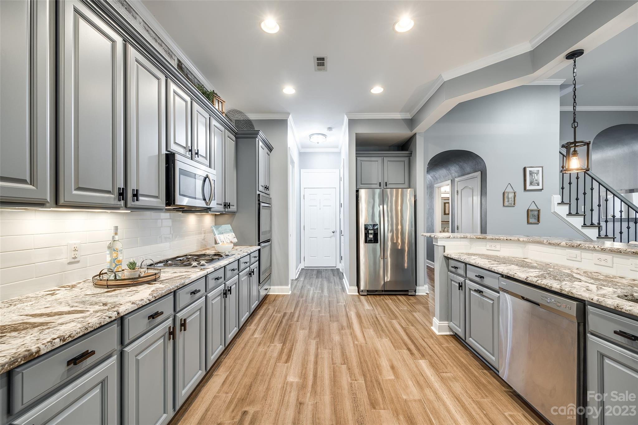 675 Quicksilver Trail Fort Mill, SC 29708 - Photo 16 of 48 a kitchen with stainless steel appliances granite countertop a stove and a sink