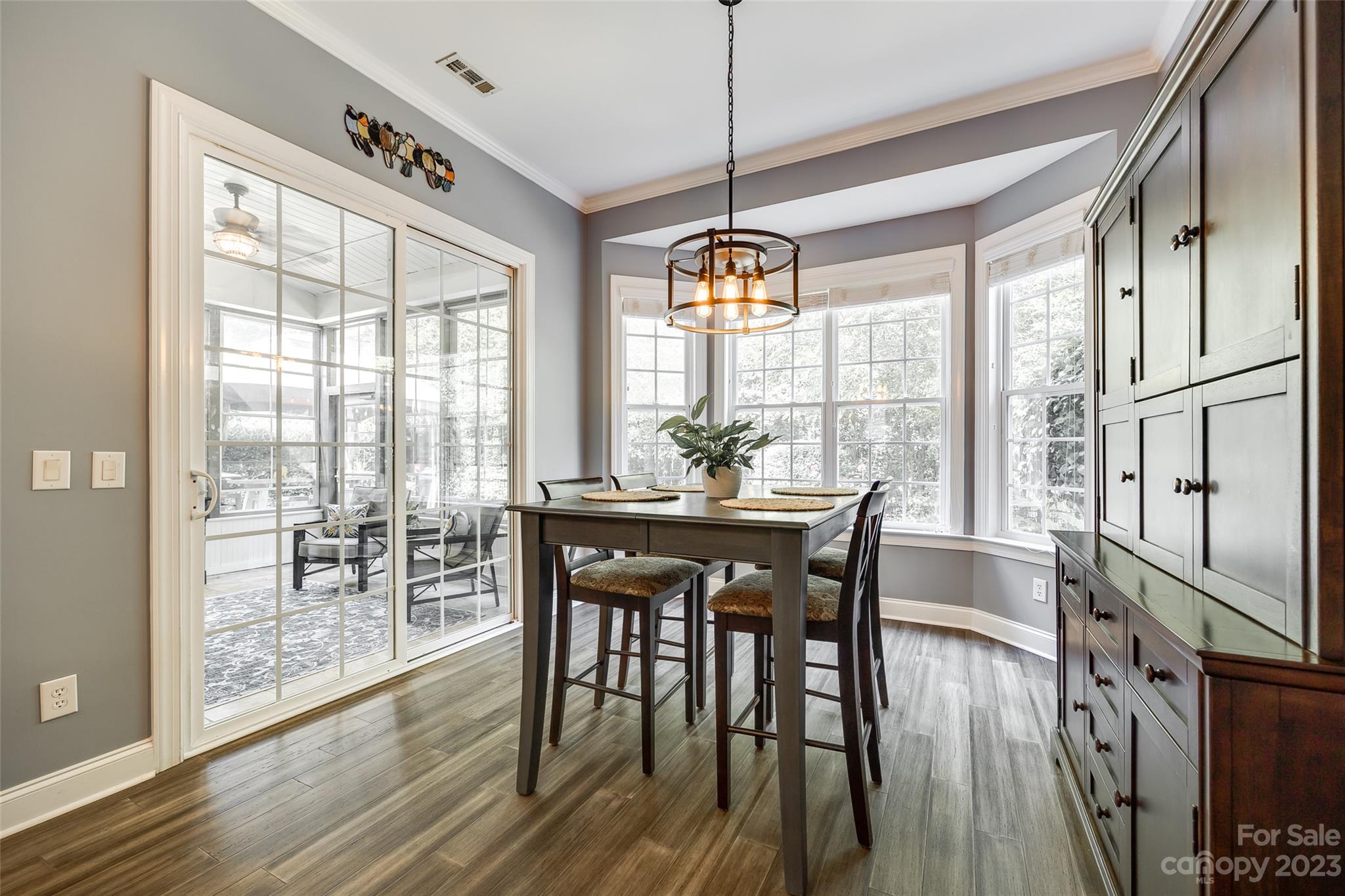 675 Quicksilver Trail Fort Mill, SC 29708 - Photo 18 of 48 a view of a dining room with furniture window and wooden floor