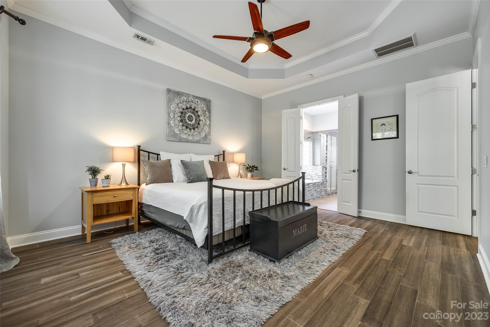 675 Quicksilver Trail Fort Mill, SC 29708 - Photo 20 of 48 a bedroom with a bed and wooden floor