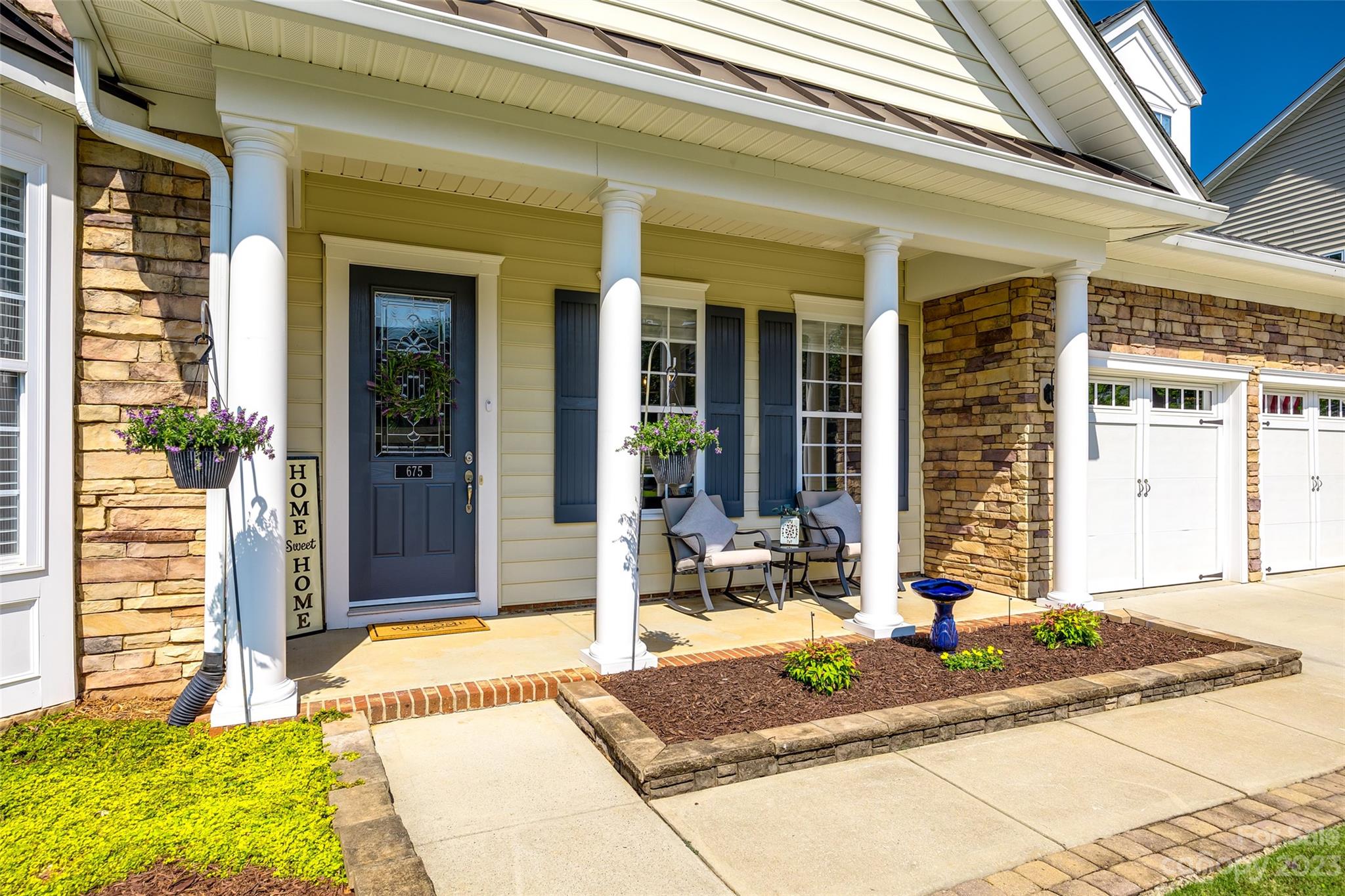 675 Quicksilver Trail Fort Mill, SC 29708 - Photo 2 of 48 a front view of a house with a patio