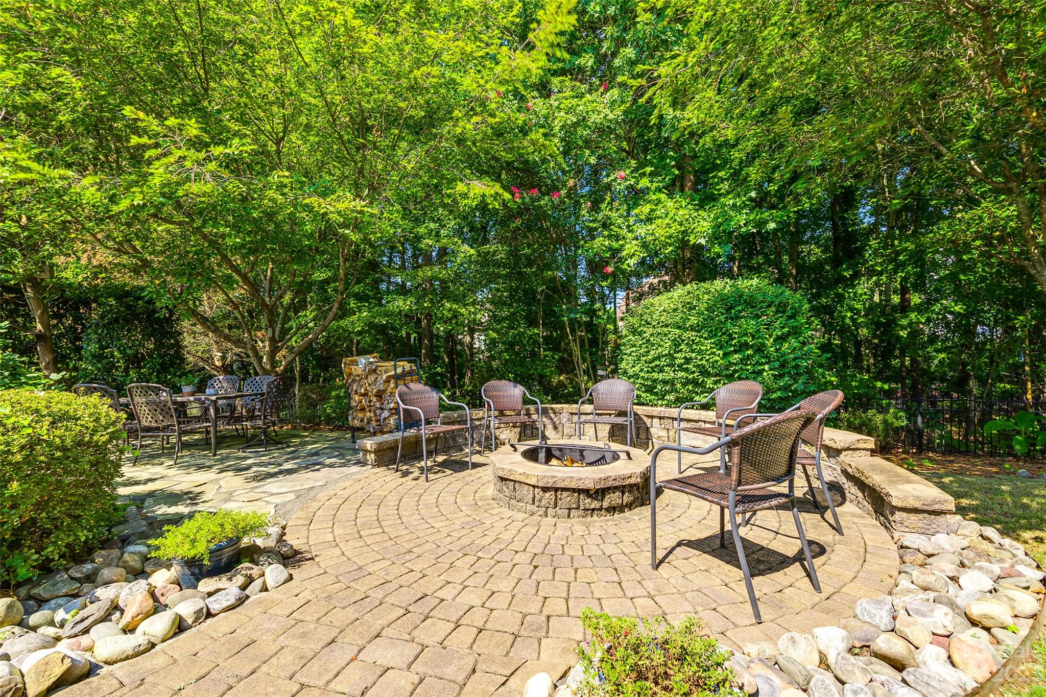 675 Quicksilver Trail Fort Mill, SC 29708 - Photo 40 of 48 a view of a patio with a dining table and chairs with wooden fence