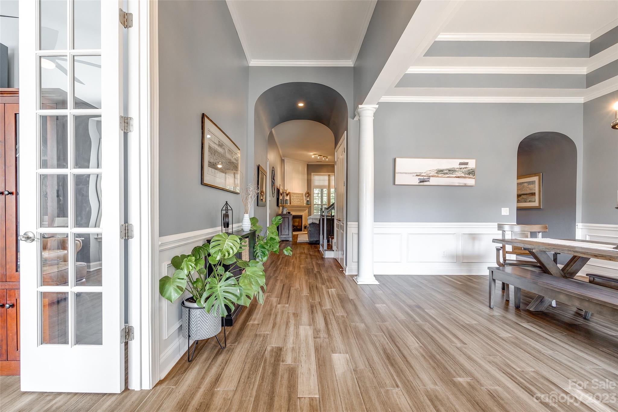 675 Quicksilver Trail Fort Mill, SC 29708 - Photo 5 of 48 a view of a room with wooden floor and potted plant