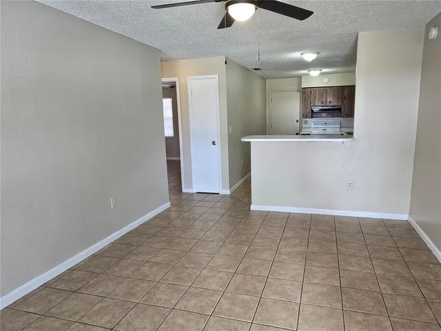 a kitchen with stainless steel appliances a sink and a refrigerator