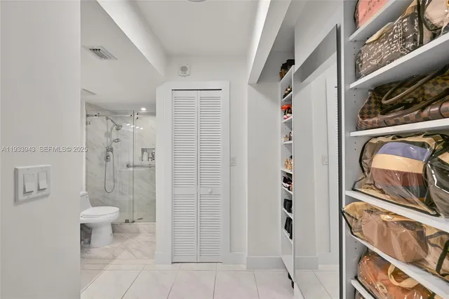 a bedroom with a large bed and a large window