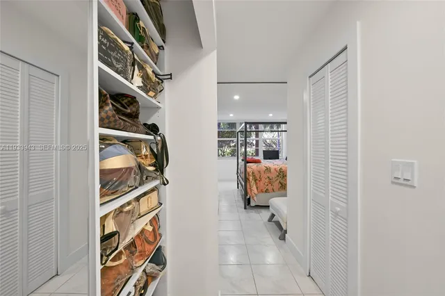 a living room filled with furniture and a potted plant