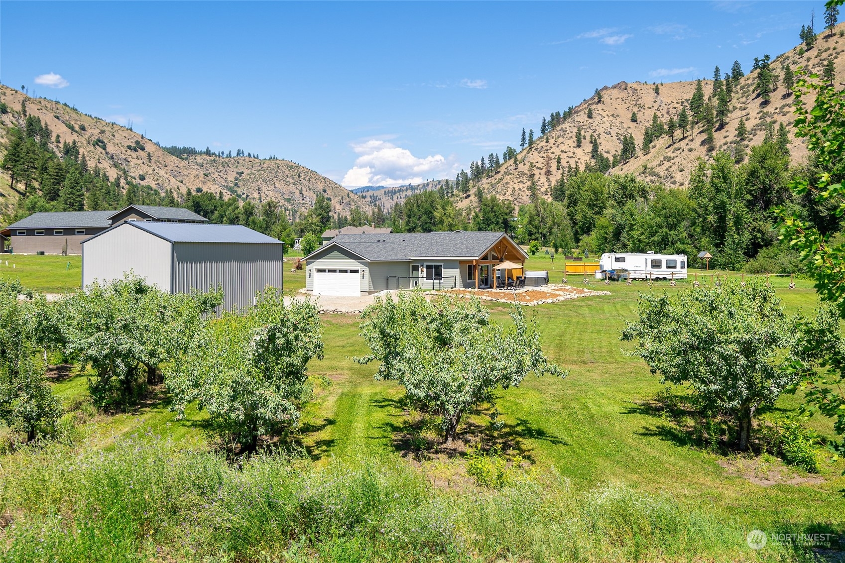 166 Mad River Road Entiat, WA 98822 - Photo 13 of 40 a view of a house with a yard and sitting area