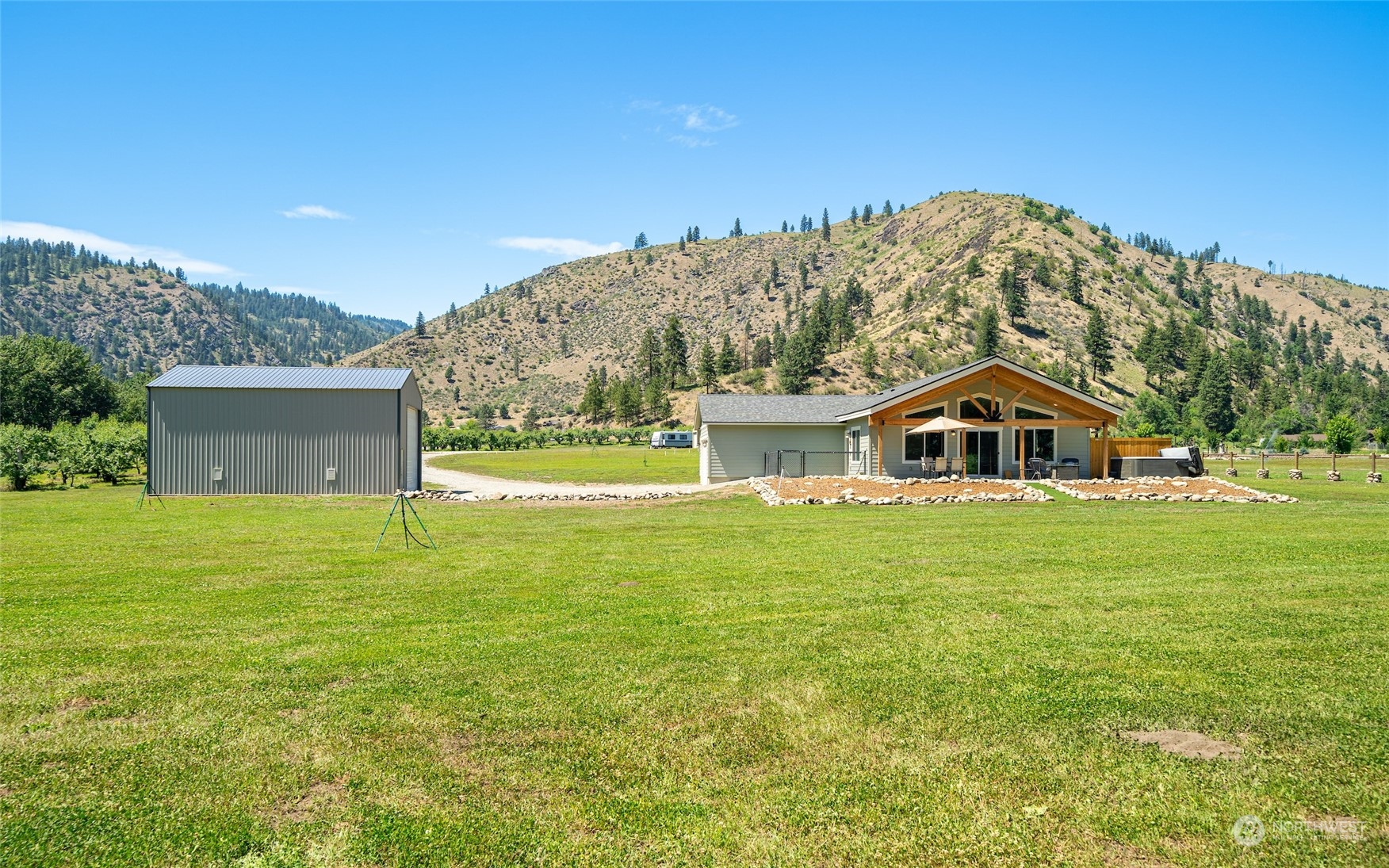 166 Mad River Road Entiat, WA 98822 - Photo 15 of 40 a front view of a house with a yard
