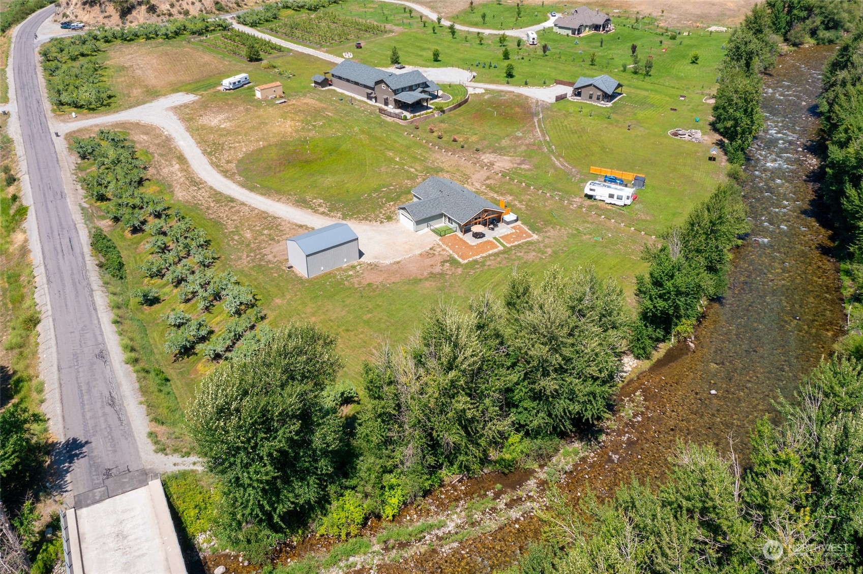 166 Mad River Road Entiat, WA 98822 - Photo 19 of 40 an aerial view of a residential houses with outdoor space and trees all around