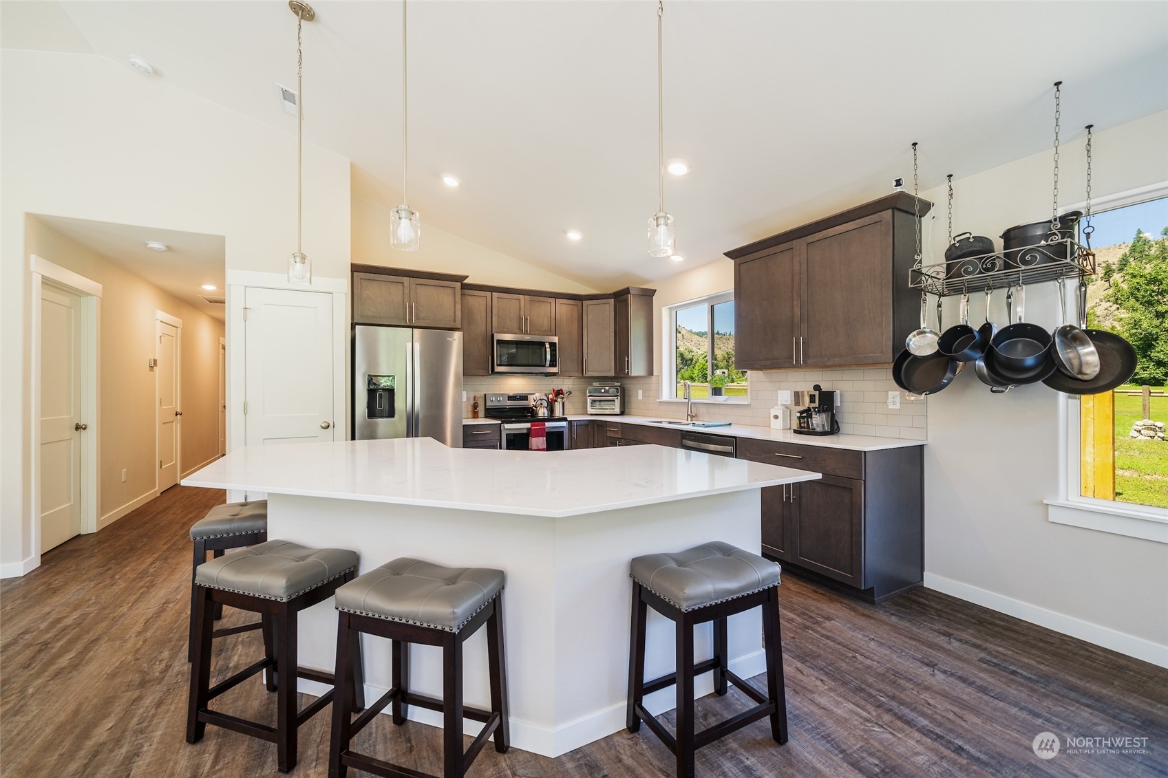 166 Mad River Road Entiat, WA 98822 - Photo 24 of 40 a kitchen with refrigerator and cabinets