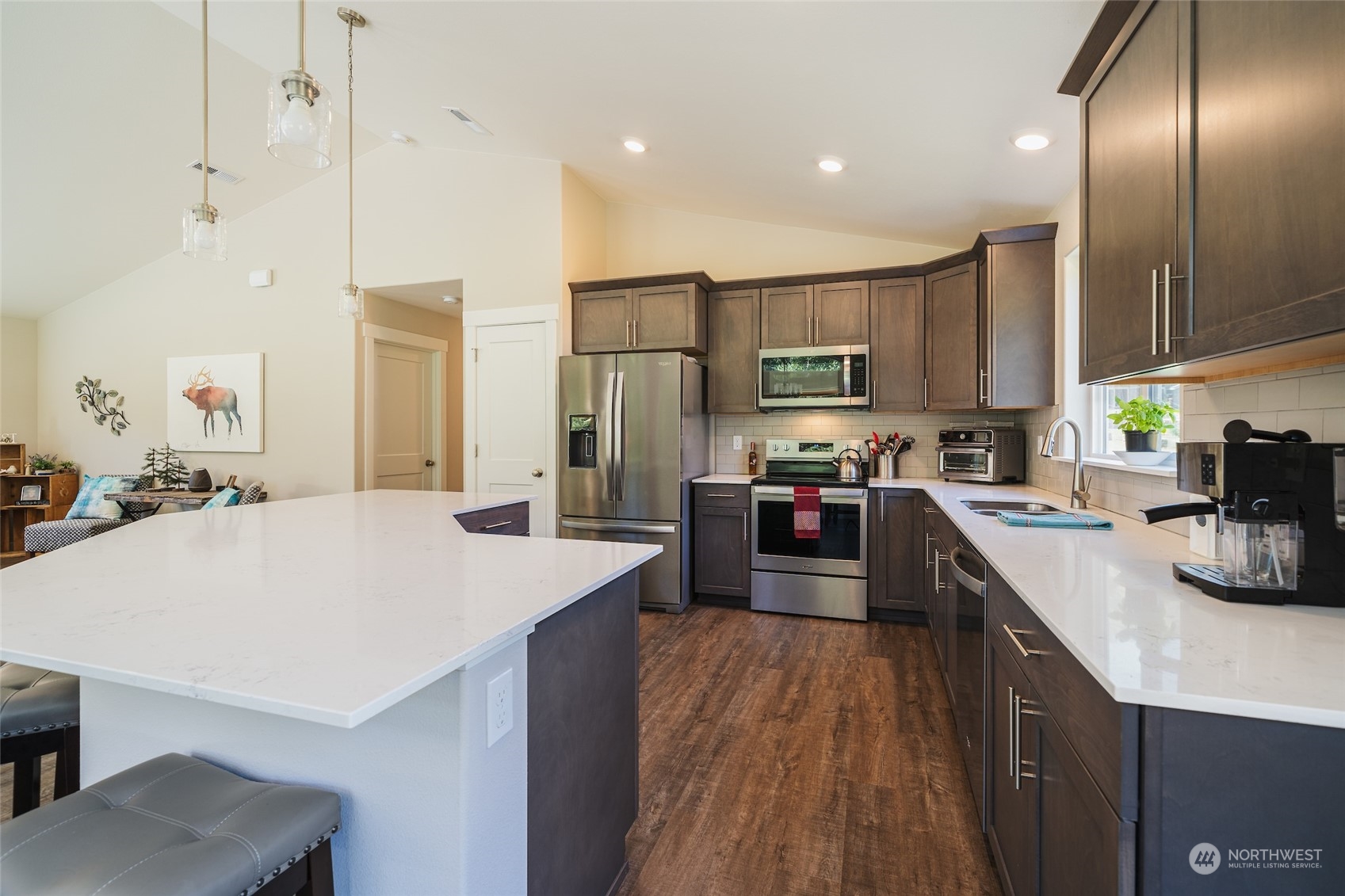 166 Mad River Road Entiat, WA 98822 - Photo 26 of 40 a kitchen with stainless steel appliances granite countertop a sink a stove and a refrigerator