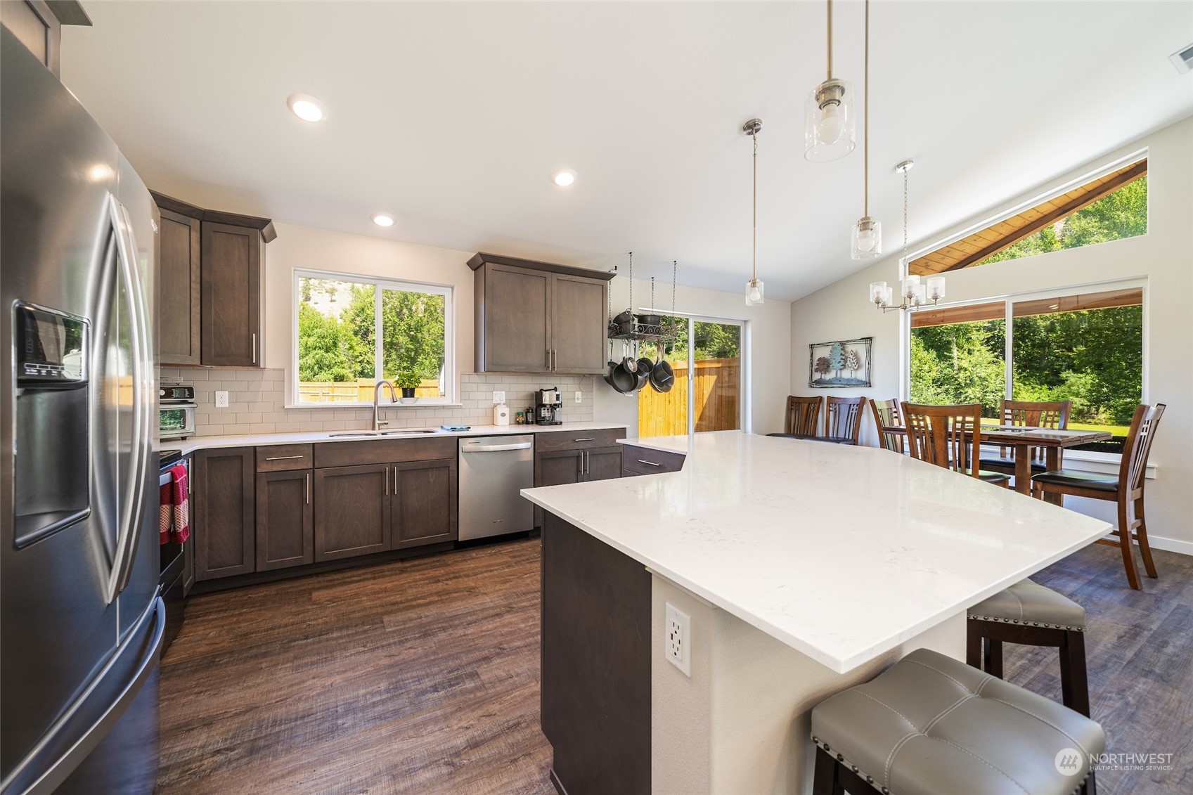 166 Mad River Road Entiat, WA 98822 - Photo 27 of 40 a kitchen with a sink a counter top space stainless steel appliances a large window and kitchen view