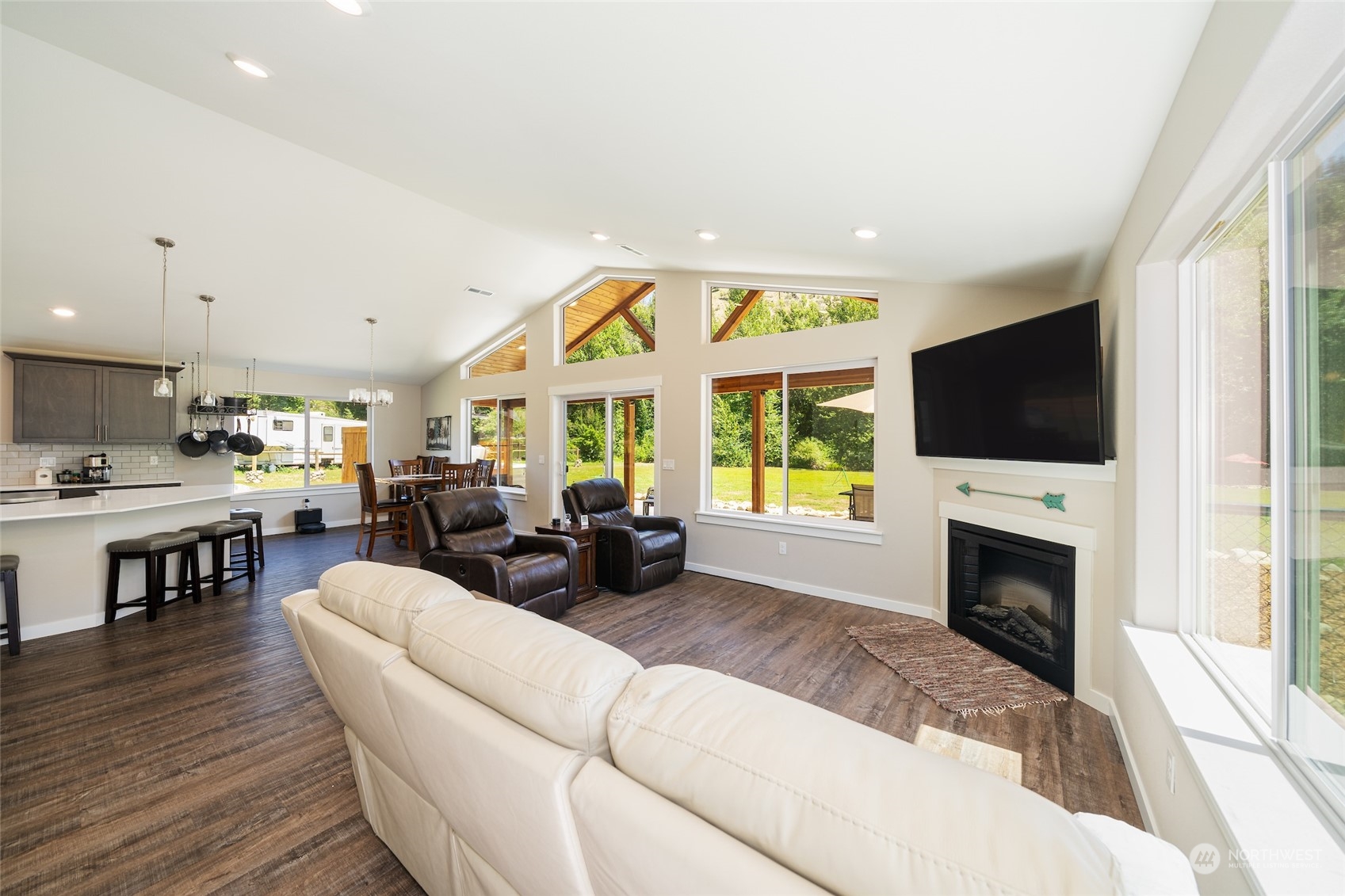 166 Mad River Road Entiat, WA 98822 - Photo 30 of 40 a living room with fireplace furniture and a flat screen tv