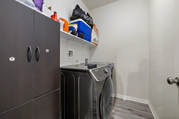 a utility room with dryer and washer
