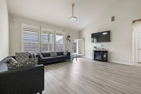 a living room with furniture and a flat screen tv