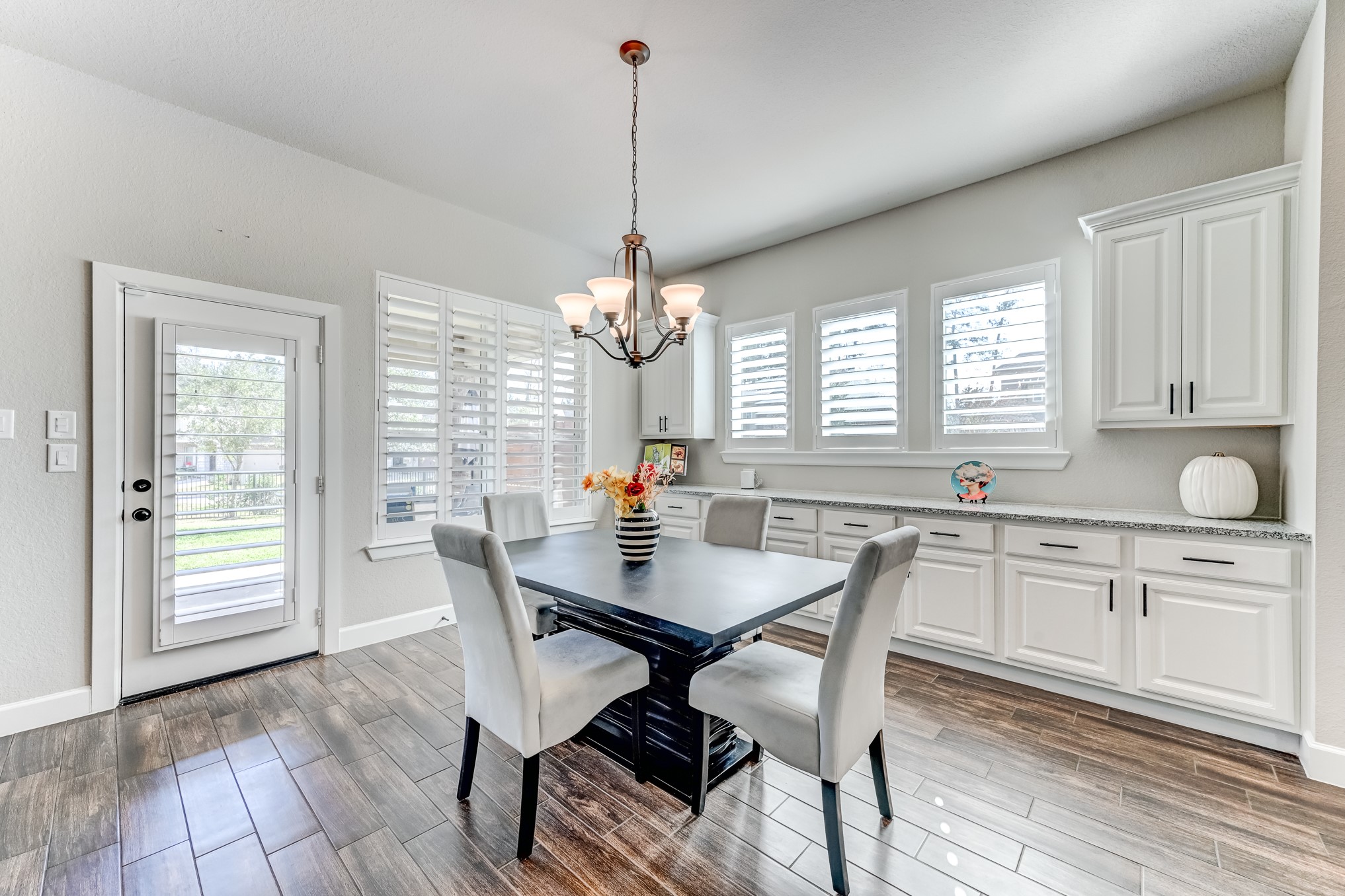 404 Summit Ridge Court Conroe, TX 77318 - Photo 15 of 50 a view of a dining room with furniture window and wooden floor
