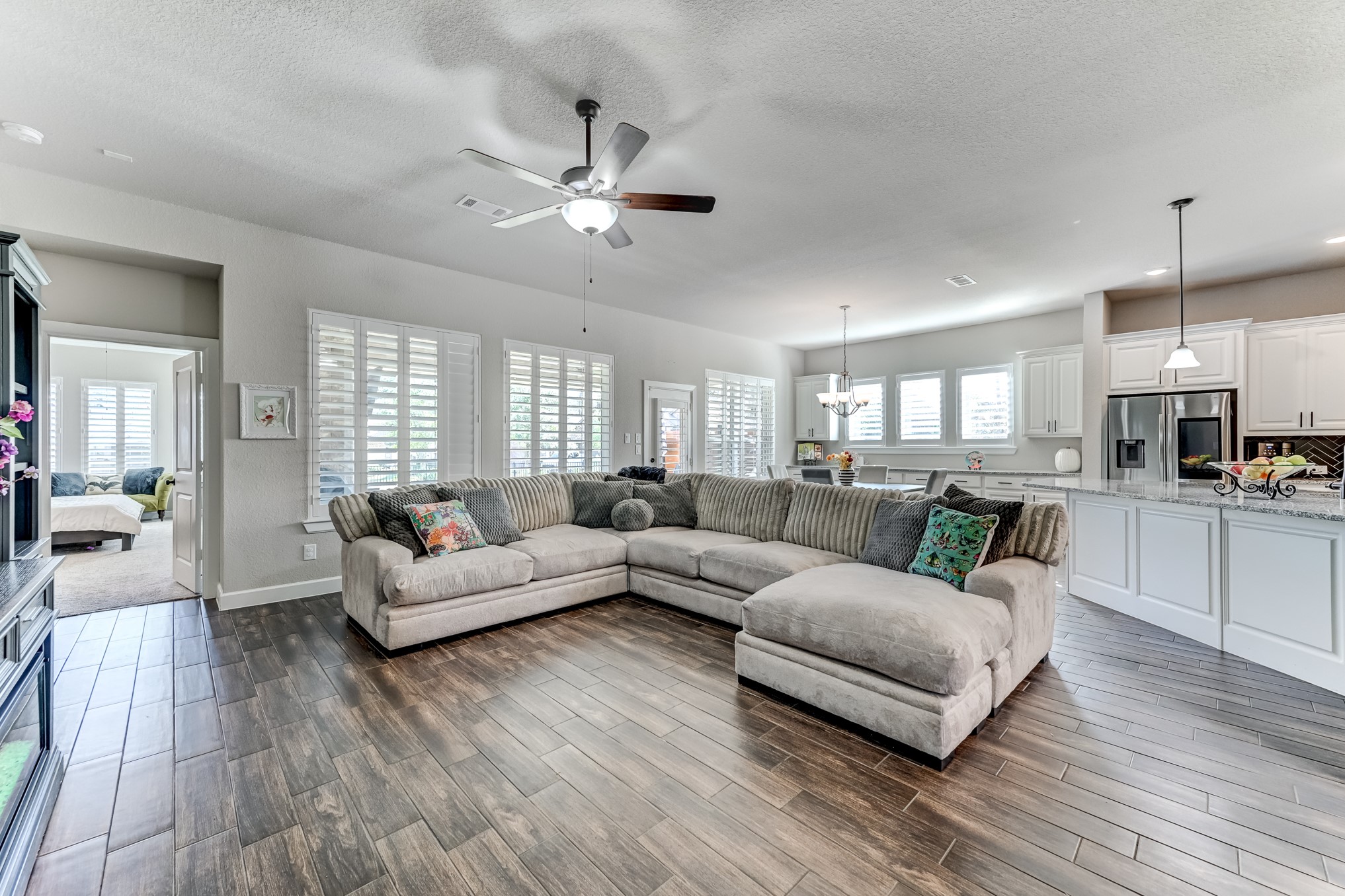 404 Summit Ridge Court Conroe, TX 77318 - Photo 20 of 50 a living room with furniture and a large window