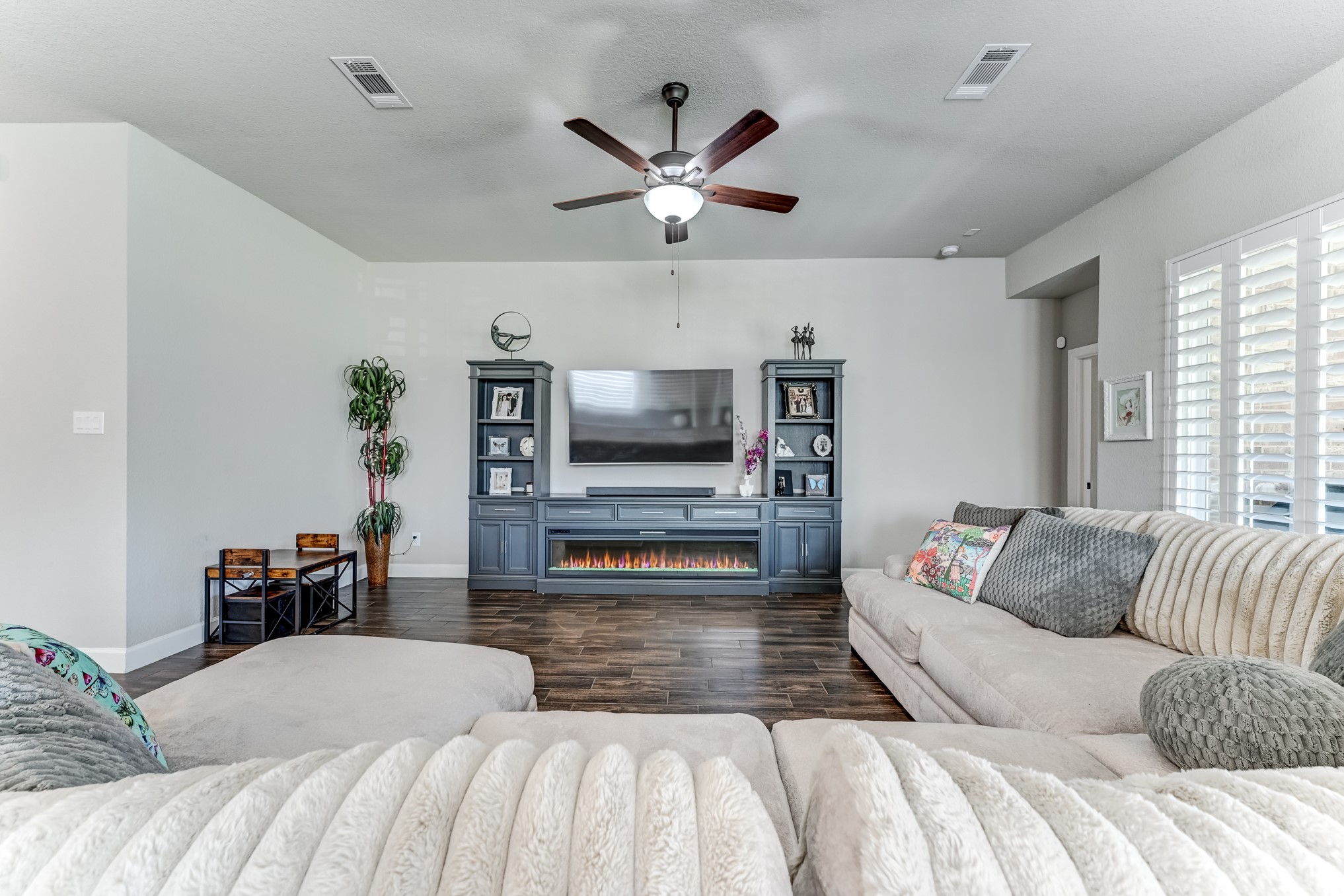 404 Summit Ridge Court Conroe, TX 77318 - Photo 22 of 50 a bedroom with a large bed and a flat screen tv